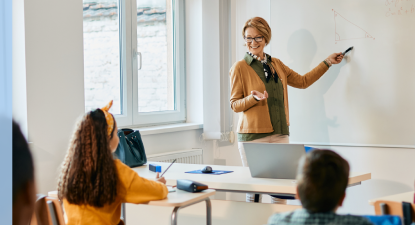 Teacher teaching math in classroom.